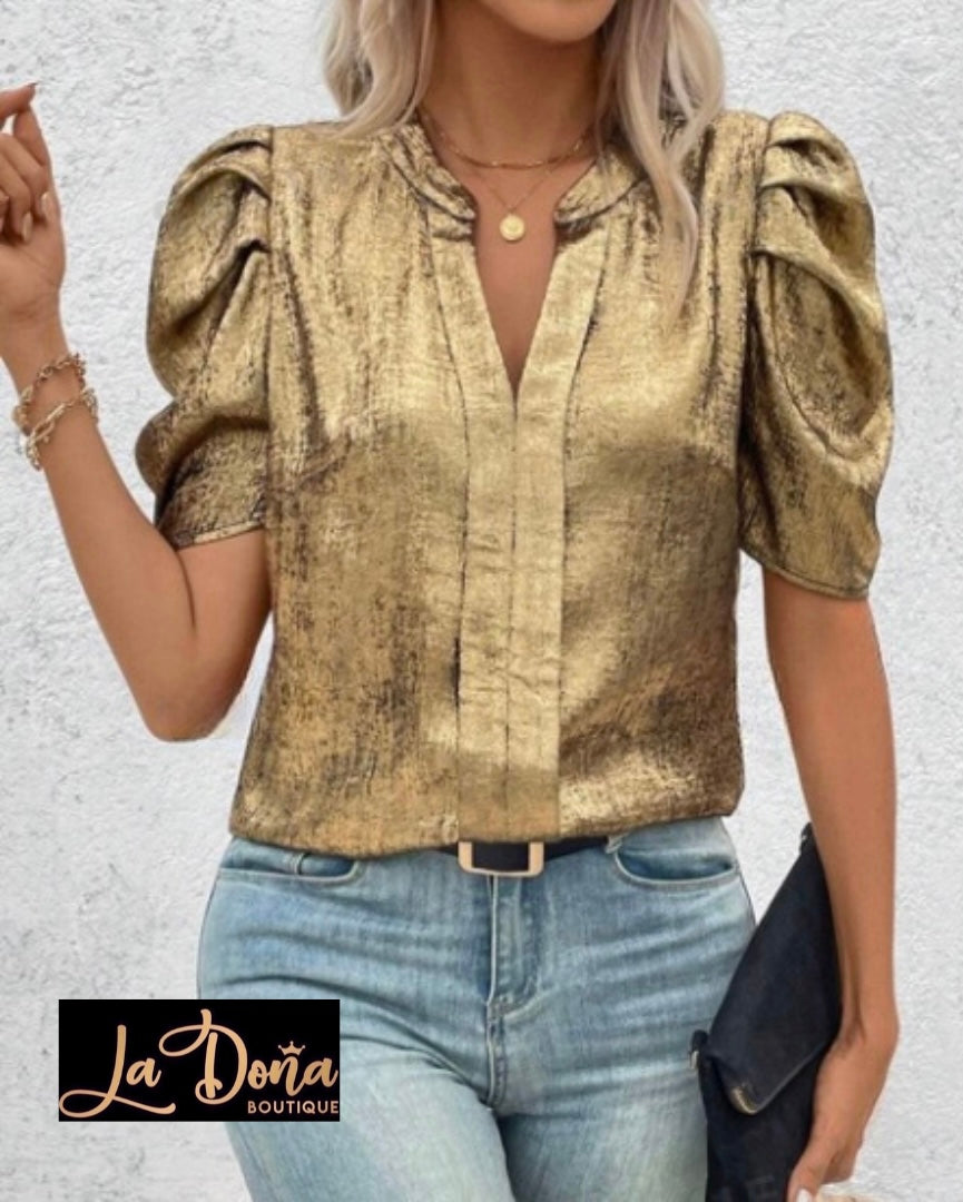 Blusa dorada metálica