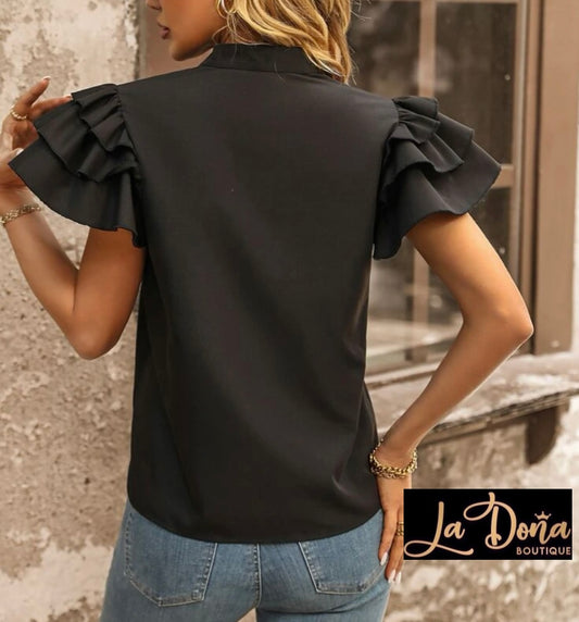 Blusa negra Olanes en mangas