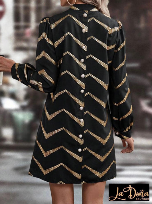 Vestido negro con dorado