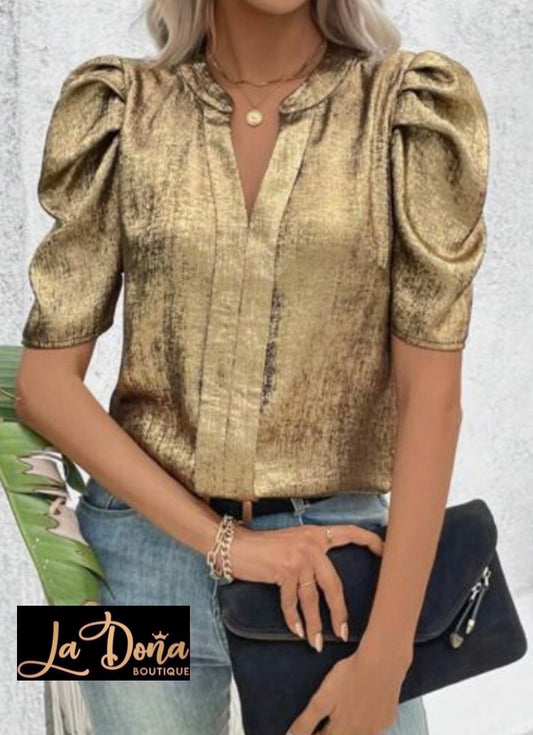 Blusa dorada metálica