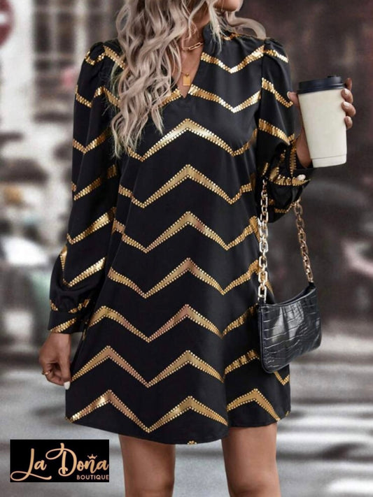 Vestido negro con dorado