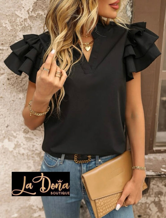 Blusa negra Olanes en mangas