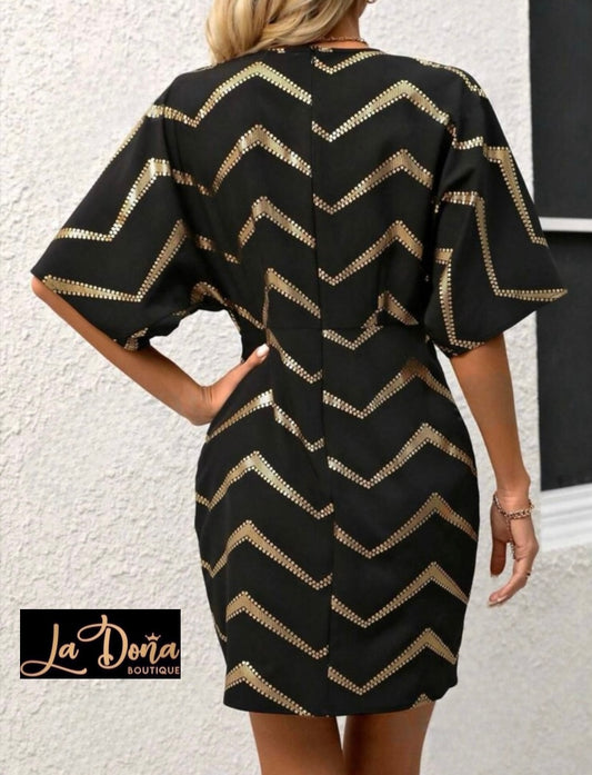 Vestido negro con dorado
